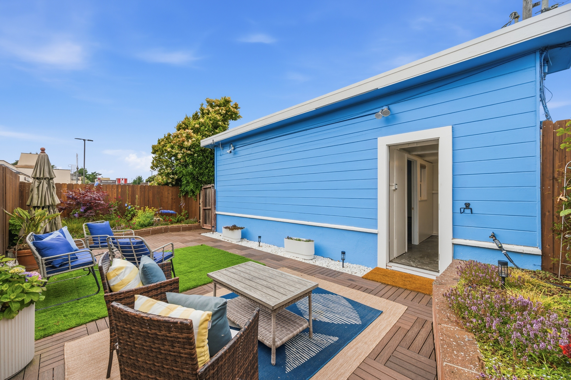 Private backyard with deck and lawn